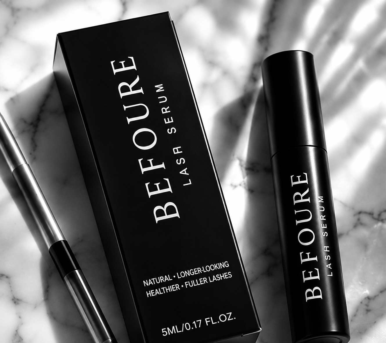 BEFOURE Lash Serum box and applicator on marble
